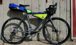 upshift frame bag colorful large multi-color green guru in use attached to bike bikepacking
