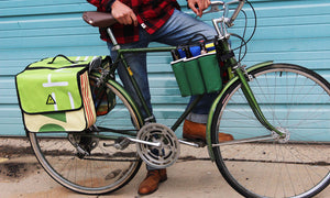 double dutch dual pannier everybike upcycled green guru colorado bike cargo mounted on townie bike in use