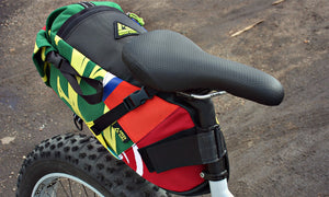 Hauler bike saddle bag green guru gear upcycled bikepacking lifestyle attached to seat post colorful