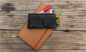 green guru small zipper pouch holding pens and pencils lifestyle sustainable recycled upcycled